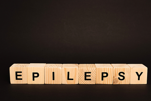 Wooden cubes with epilepsy lettering isolated on black