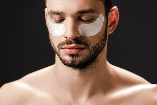bearded nude man with eye patches on face isolated on grey