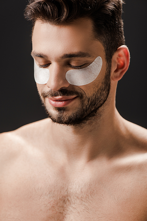 sexy positive nude man with eye patches on face isolated on grey