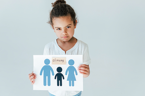 upset african american kid holding paper with drawn family and alimony lettering isolated on white