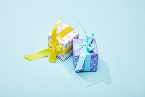 dotted festive colorful gift boxes on blue background