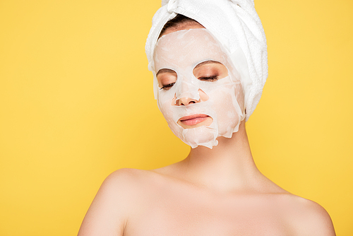 naked beautiful woman with towel on head and face mask isolated on yellow