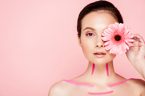 naked beautiful woman with pink lines on body and chrysanthemum near eye isolated on pink