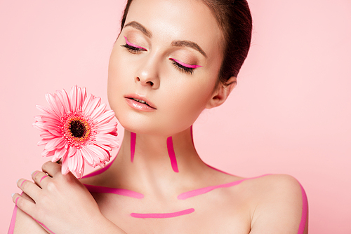 naked beautiful woman with pink lines on body and chrysanthemum isolated on pink
