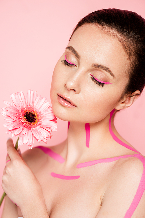 naked beautiful woman with pink lines on body and flower isolated on pink