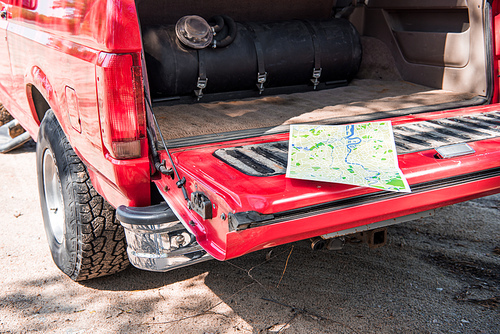 map in open red car in sunny day