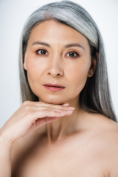 adult asian naked woman with perfect skin and grey hair isolated on grey