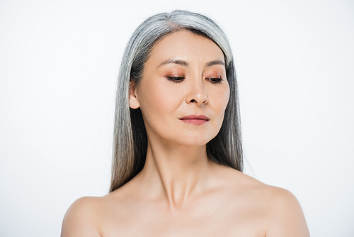 attractive adult asian naked woman with perfect skin and grey hair isolated on grey
