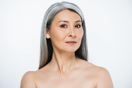 beautiful adult asian naked woman with perfect skin and grey hair isolated on grey