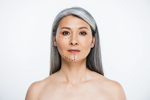 attractive naked asian woman with plastic surgery lines on face isolated on grey