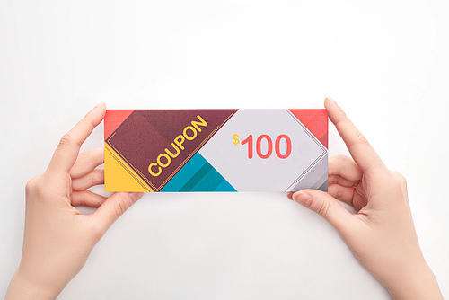 Top view of woman holding coupon with 100 dollars sign on white background