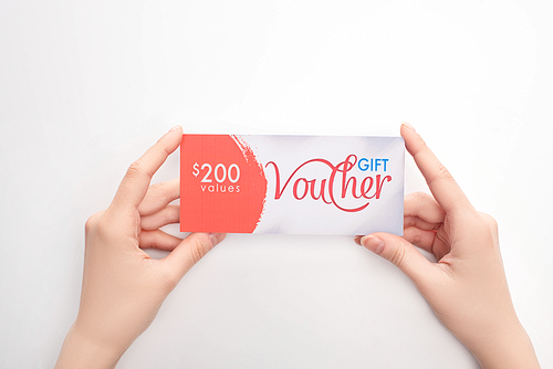 Top view of woman holding gift voucher with values lettering on white background