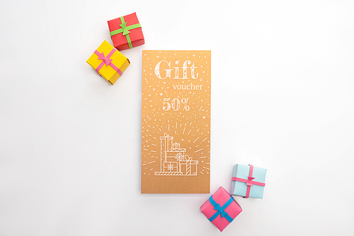 Top view of gift voucher with 50 presents on white background
