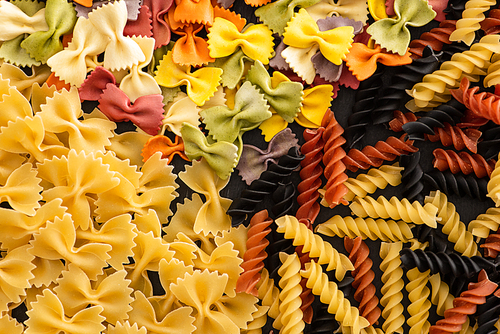 top view of various raw colorful Italian pasta