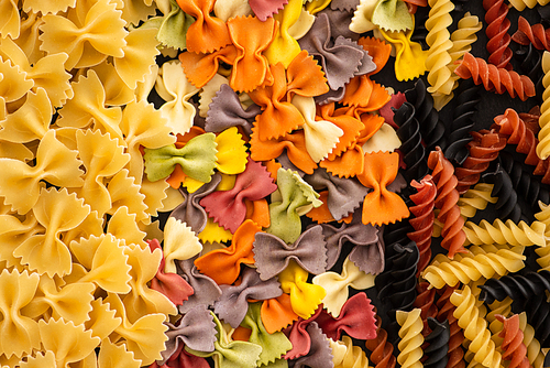 top view of various raw colorful Italian pasta