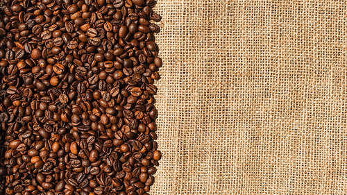 top view of roasted coffee beans on sackcloth