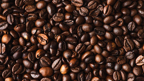 top view of fresh roasted coffee beans background