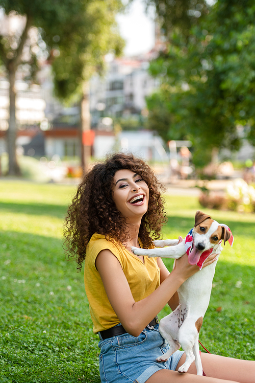 Selective focus of excited woman with jack russell terrier dog 