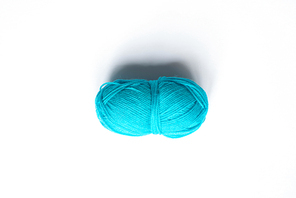top view of blue wool yarn on white background