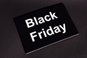 placard with black friday lettering on dark background