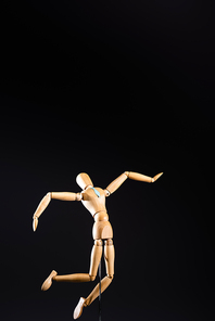 wooden marionette in tie isolated on black