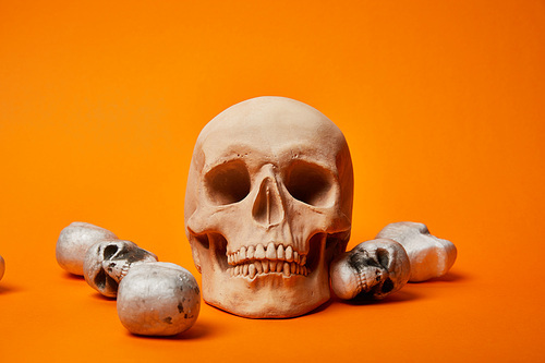 skulls on orange background, Halloween decoration