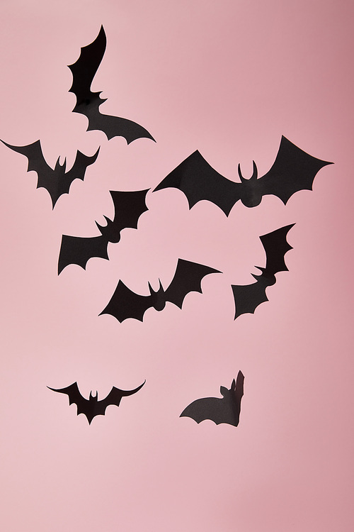 black paper bats on pink background, Halloween decoration