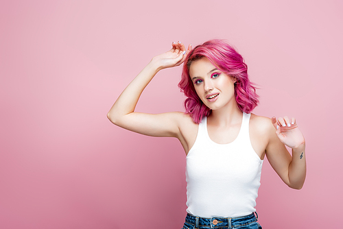 young woman with colorful hair posing isolated on pink