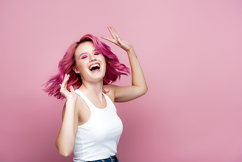 young woman with colorful hair rejoicing isolated on pink