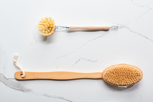 top view of body brushes on marble surface