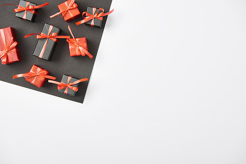 top view of presents on white and black background with copy space