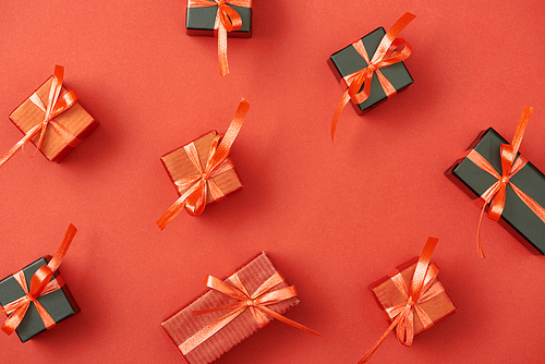 top view of small gift boxes on red background
