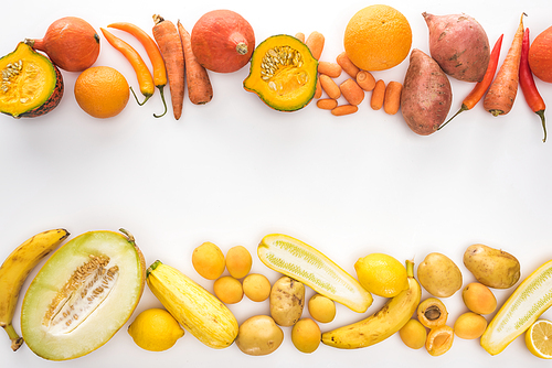 top view of fresh colorful vegetables and fruits on white background with copy space