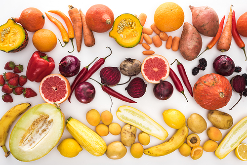top view of assorted autumn vegetables, citruses, fruits and berries on white background