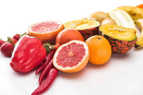 peppers, carrots, oranges, pumpkin and grapefruit on white background