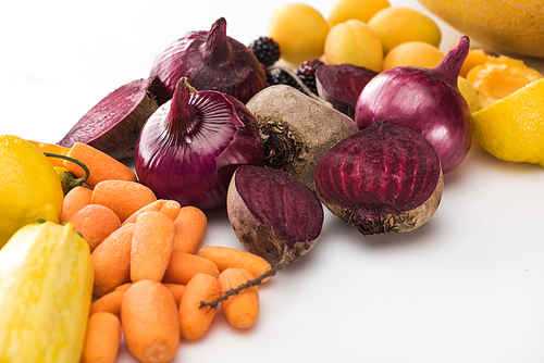 carrots, red onions, beetroots, apricots on white background