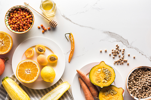 top view of season autumn fruits, vegetables and berries with chickpea on marble surface