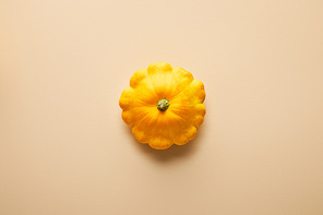 top view of ripe whole colorful Pattypan squash on beige background