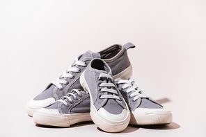 grey casual sneakers on white background