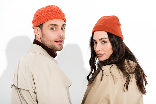 trendy couple in beanie hats  on white