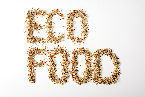 top view of  food lettering made of sprouts on white background
