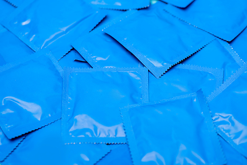 close up of blue packs with condoms