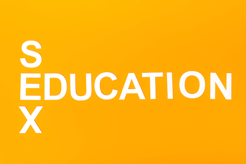 top view of white sex education lettering isolated on orange