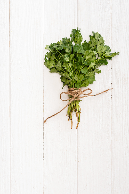 top view of parsley on white wooden table