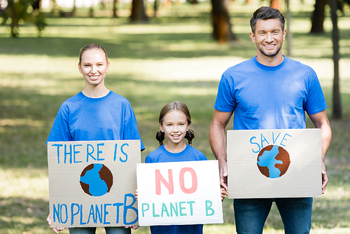 smiling family of activists holding placards with there is no planet b inscription, ecology concept