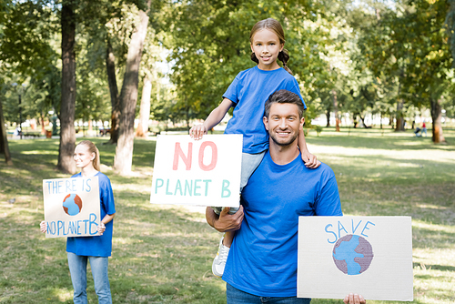 happy family of volunteers holding placards with there is no planet b inscription and globe, ecology concept