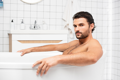 Bearded man  while taking bath at home