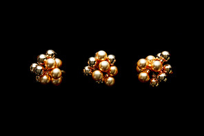 top view of shiny golden Christmas decoration isolated on black