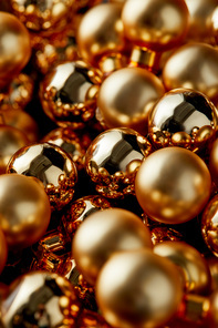 close up view of shiny golden Christmas baubles