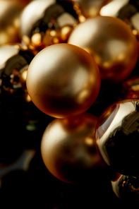 close up view of shiny golden Christmas balls